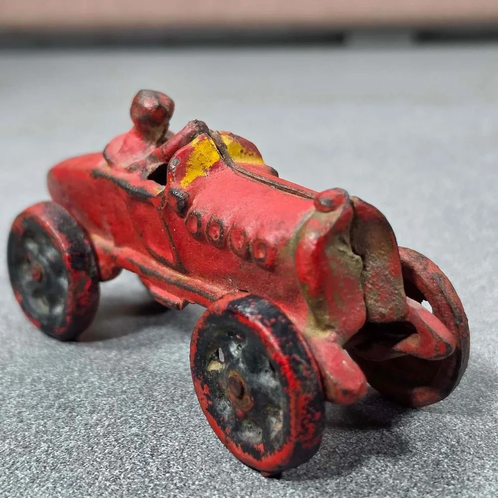 Antique Hubley Cast Iron Boat-tail Race Car Toy Driver 1920's.